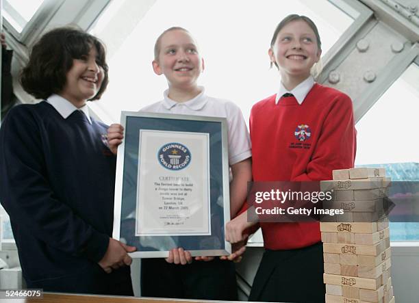 Pupils from Sir John Cass's Foundation School Khuncha Sabir, Charlie Miller and Ruby Carter following their successful attempt at the Guinness World...