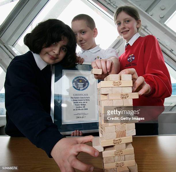 Pupils from Sir John Cass's Foundation School Khuncha Sabir, Charlie Miller and Ruby Carter following their successful attempt at the Guinness World...