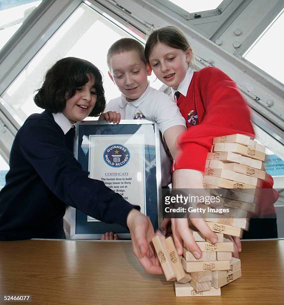 Pupils from Sir John Cass's Foundation School Khuncha Sabir, Charlie Miller and Ruby Carter following their successful attempt at the Guinness World...