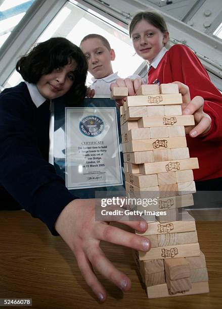 Pupils from Sir John Cass's Foundation School Khuncha Sabir, Charlie Miller and Ruby Carter following their successful attempt at the Guinness World...