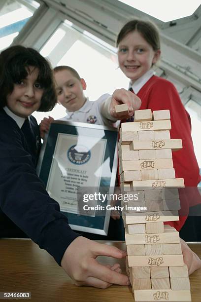 Pupils from Sir John Cass's Foundation School Khuncha Sabir, Charlie Miller and Ruby Carter following their successful attempt at the Guinness World...