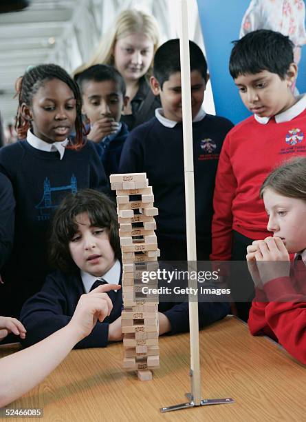 Guinness World Records challenge Jenga enthusiasts to build 30 levels of the popular building game in the fastest time possible at The Walkways,...