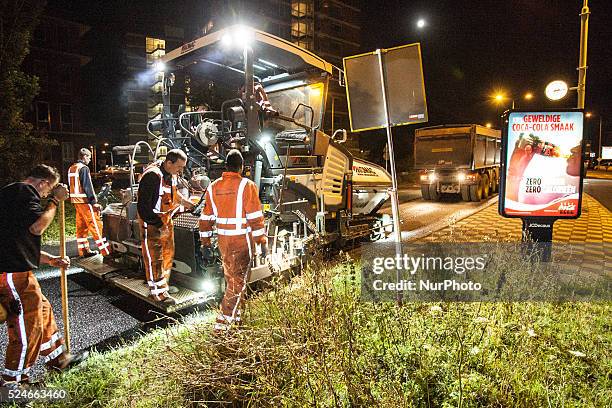 The Netherlands - Part of the entrance road to the university city is given a new top layer of asphalt. Such work is increasingly being done at...