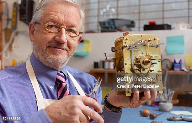109 Man Adjusting Clock Stock Photos, High-Res Pictures, and Images ...