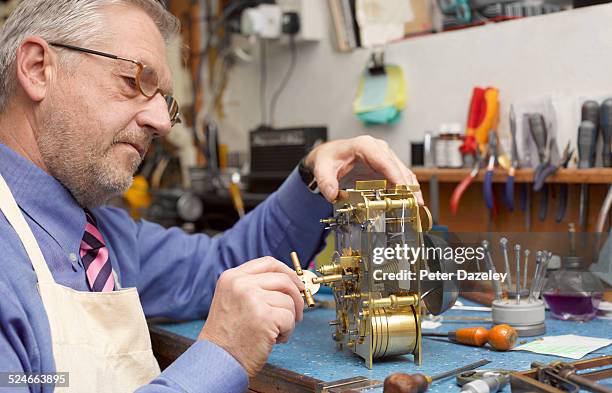 Man Fixing Clock Old Man Fixing Clock Photos and Premium High Res Pictures - Getty Images