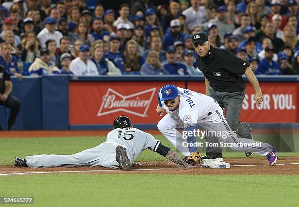 Brett Lawrie of the Chicago White Sox gets back safely to third base in the fifth inning during MLB game action as Troy Tulowitzki of the Toronto...
