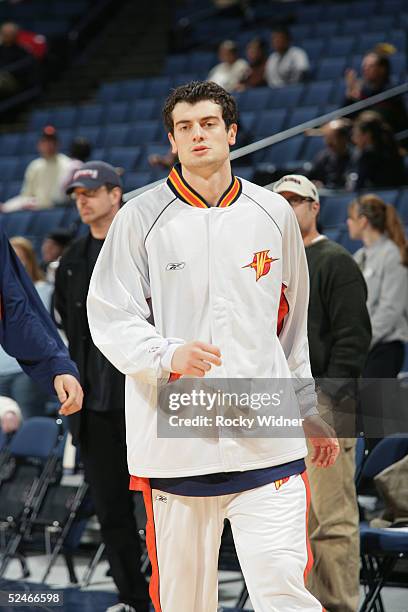 Nikoloz Tskitishvili of the Golden State Warriors warms up prior to the game against the Detroit Pistons at The Arena in Oakland on February 27, 2005...