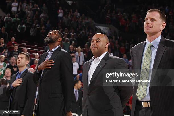 Brad Stevens of the Boston Celtics and the assistant coaches Walter McCarty, Micah Shrewsberry, and Jay Larranaga stand for a moment of silence for...