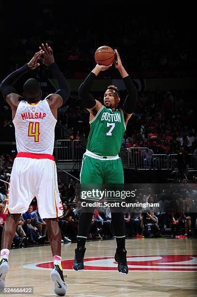 Jared Sullinger of the Boston Celtics shoots against Paul Millsap of the Atlanta Hawks in Game Five of the Eastern Conference Quarterfinals during...