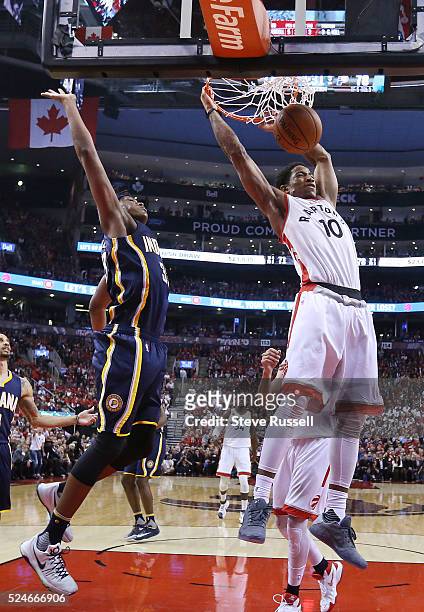 Toronto Raptors guard DeMar DeRozan dunks in front of Myles Turner as the Toronto Raptors beat Indiana Pacers in game five 102-99 in their first...
