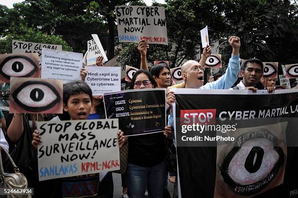 Protesters hold a demonstration to mark the global "The Day We Fight Back" protest against mass surveillance outside the Supreme Court in Manila,...