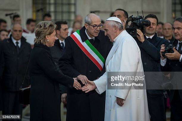 Pope Francis greets Francesco Paolo Tronca, new commissioner of Rome and his wife at the statue of the Virgin Mary during the annual feast of the...