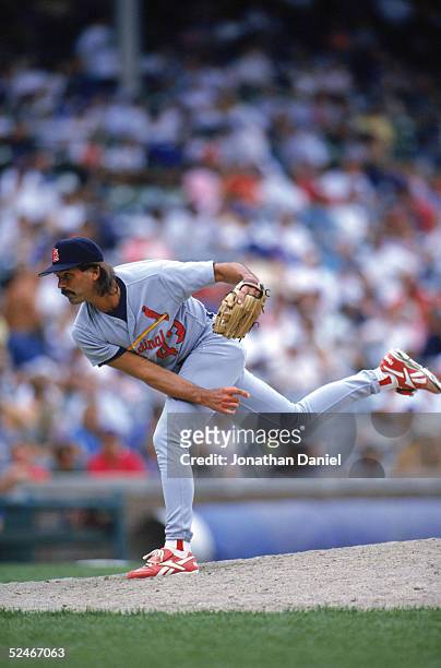Dennis Eckersley of the St. Louis Cardinals delivers a pitch during a game with the Chicago Cubs at Wrigley Field on July 12, 1996 in Chicago,...