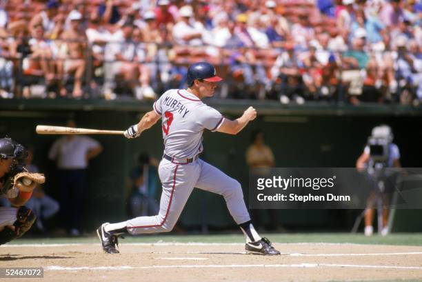 Dale Murphy of the Atlanta Braves swings a misses for a strike during a game against the San Diego Padres in 1987 at Jack Murphy Stadium in San...