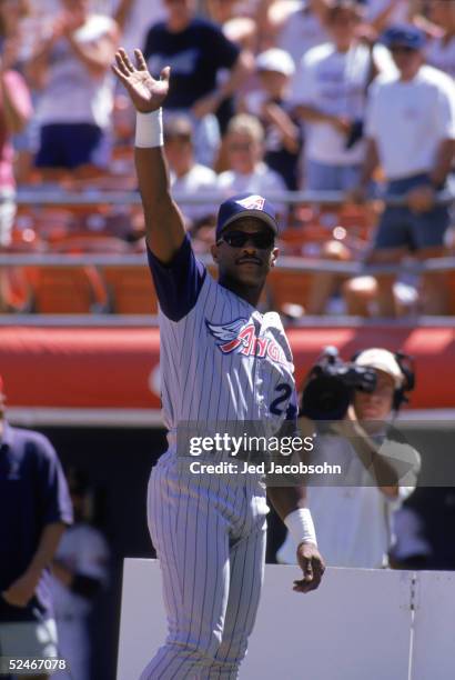 Rickey Henderson of the Anaheim Angels waves to the fans during a game with the San Diego Padres at Qualcomm Stadium on August 28, 1997 in San Diego,...