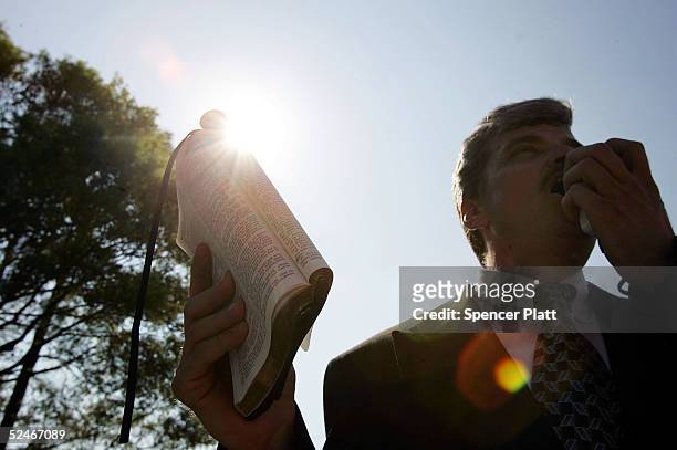 Supporter of brain-damaged Florida woman Terri Schiavo preaches with a bible in front of the Woodside Hospice where Schiavo is being cared for, March...