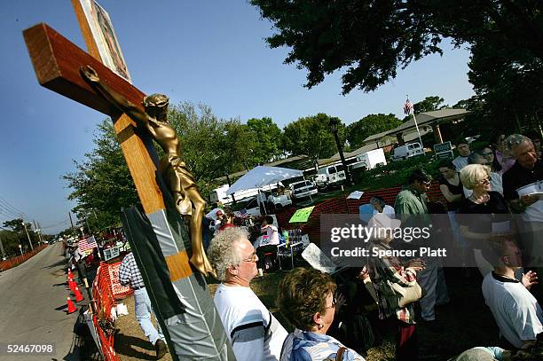 Supporters of brain-damaged Florida woman Terri Schiavo gather in front of the Woodside Hospice where Schiavo is being cared for, March 22, 2005 in...