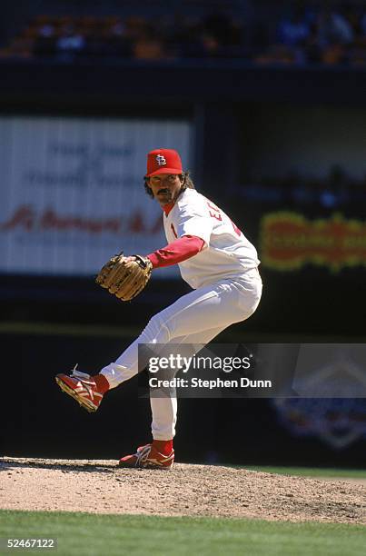 Dennis Eckersley of the St. Louis Cardinals winds up for a pitch during a game against the Houston Astros at Busch Stadium on April 14, 1997 in St....