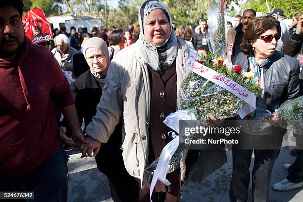 Mubarka Brahmi with flowers to the family of Martyr Belaid. On the occasion of the commemoration of the first anniversary of the assassination of...