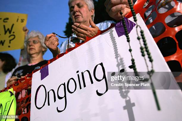 Supporters of brain-damaged Florida woman Terri Schiavo gather in front of the Woodside Hospice where Schiavo is being cared for, March 22, 2005 in...