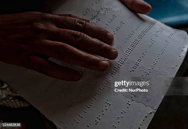 Blind, learns Braille writing at Abhedananda Home, a school for deaf, dumb and blind students on September 01, 2015 in Srinagar, the summer capital...