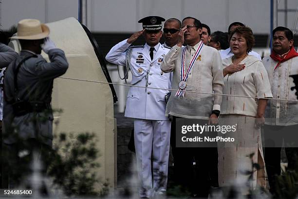 Philippine President Benigno Aquino III adjusts his glasses during the singing of the national anthem at the Bonifacio Monument Circle in Caloocan...