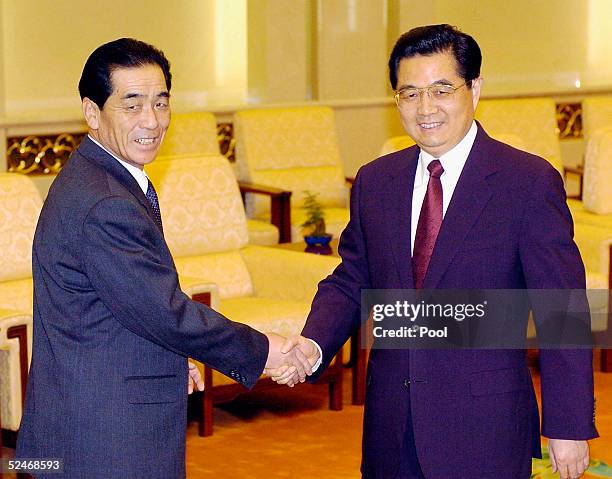 Premier Pak Bong Ju of the Democratic People's Republic of Korea and Chinese President Hu Jintao shake hands at Fujian Halll, the Great Hall of...