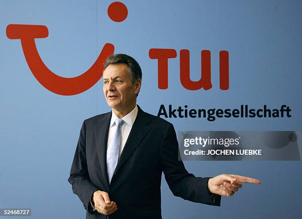 Michael Frenzel, chairman of Europe's leading travel and tourism group TUI, is pictured in front of his company's logo prior to present the annual...