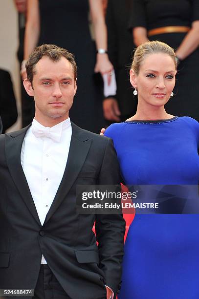 Jude Law and Uma Thurman at the premiere of "Les Bien-Aimes" Premiere and Closing Ceremony Arrivals during the 64th Cannes International Film...