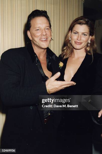 Actor Mickey Rourke and actress Carrie Otis attend the Pirelli Calendar launch party at Spencer House on November 14, 1995 in London, England.