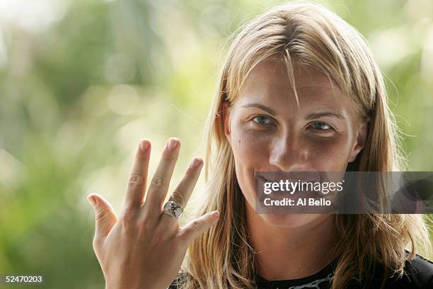 Svetlana Kuznetsova of Russia shows her ring to the press during the WTA media day during the NASDAQ-100 Open at the Crandon Park Tennis Center on...