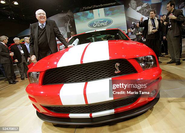 Manufacturer and automotive legend Carroll Shelby stands next to the Ford Shelby Mustang Cobra GT500 at the 2005 New York International Auto Show...