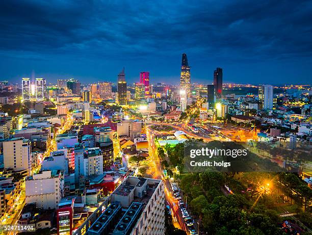 ho chi minh city in vietnam at night - hochi minh stock pictures, royalty-free photos & images