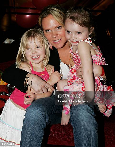 Louise Adams poses with her children Talula and Myla at the "Disney Live: Winnie The Pooh On Stage" Gala Performance, a red carpet event held in aid...