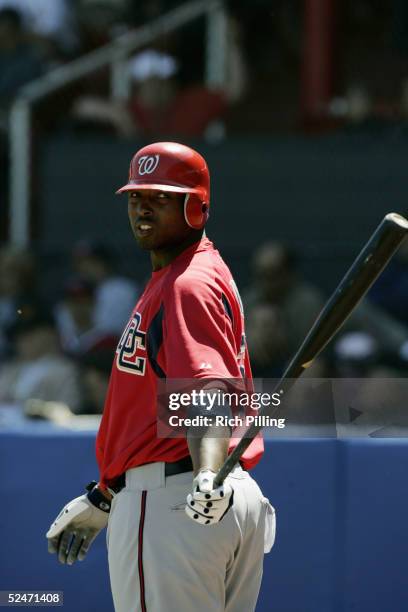 Outfielder J.J. Davis of the Washington Nationals is on deck during the Spring Training game against the Cleveland Indians at Chain of Lakes Park on...