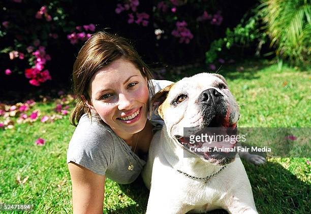 Actress Jessica Biel poses for a portrait with her Bulldog East at the Santa Monica Pier June 2003 in Santa Monica, California.