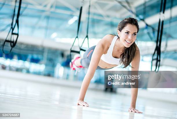 woman exercising at the gym - suspension training stock pictures, royalty-free photos & images