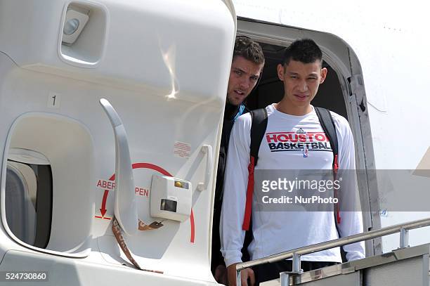 Houston Rockets point guard Jeremy Lin and power forward Chandler Parsons walk out their plane door upon arrival at the Ninoy Aquino International...