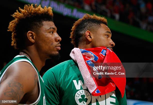 Marcus Smart and Jared Sullinger of the Boston Celtics react in the final seconds of their 110-83 loss to the Atlanta Hawks in Game Five of the...