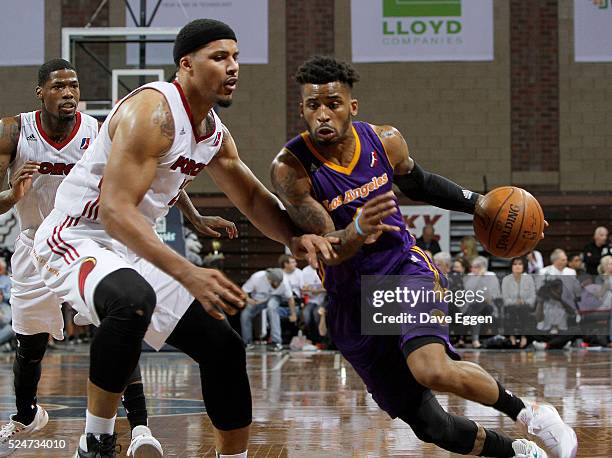 Vander Blue from the Los Angeles Defenders drives against Jarnell Stokes from the Sioux Falls Skyforce during the NBA D-League Finals Game 2 at the...