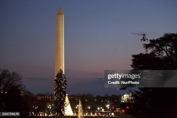 On Friday, December 18 US President Barack Obama and the first family depart from the South Lawn of The White House on Marine One enroute to their...