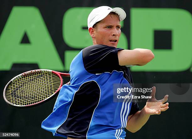 Florian Mayer of Germany returns to Lars Burgsmuller of Germany during the NASDAQ-100 Open at the Crandon Park Tennis Center on March 24, 2005 in Key...