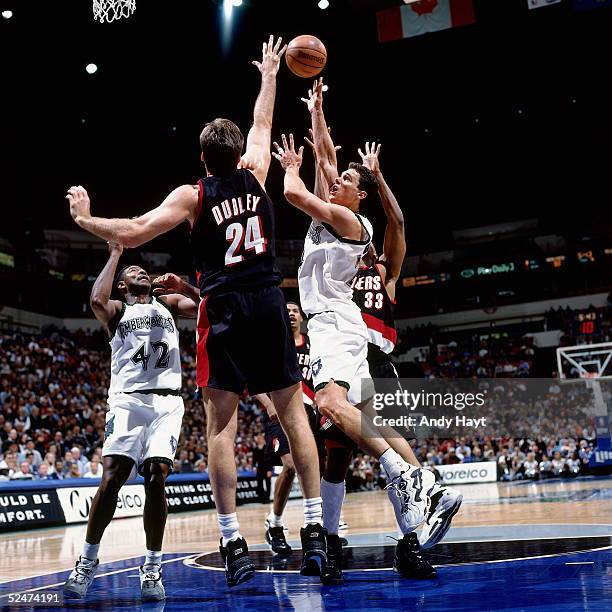 Tom Gugliotta of the Minnesota Timberwolves drives to the basket into traffic against the Portland Trail Blazers on November 12, 1996 at the the...