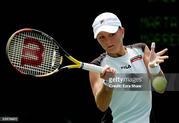 Tatiana Perebiynis of the Ukraine returns a shot to Marta Marrero of Spain during the NASDAQ-100 Open at the Crandon Park Tennis Center on March 24,...