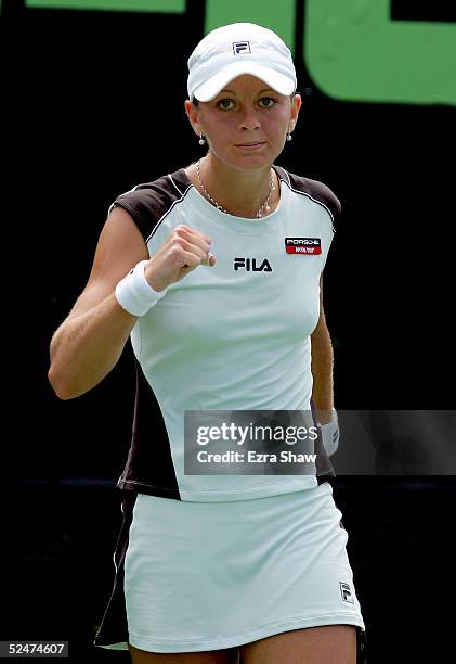 Tatiana Perebiynis of the Ukraine celebrates a point over Marta Marrero of Spain during the NASDAQ-100 Open at the Crandon Park Tennis Center on...