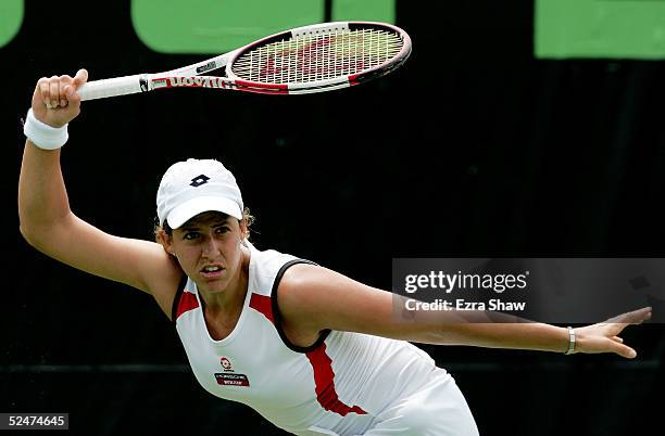 Marta Marrero of Spain returns to Tatiana Perebiynis of the Ukraine during the NASDAQ-100 Open at the Crandon Park Tennis Center on March 24, 2005 in...