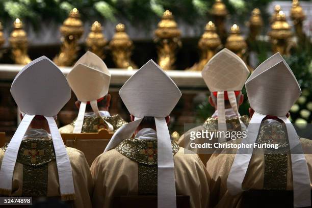 Cardinals face the altar as Colombian Cardinal Alfonso Lopez Trujillo gives the Mass of The Lords Supper in St Peter's Basilica March 24, 2005 in...
