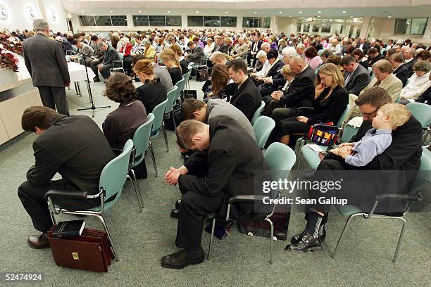 Members of the Jehova's Witnesses Church pray during a religious service March 24, 2005 in Hennigsdorf, Germany, just outside of Berlin. A Berlin...