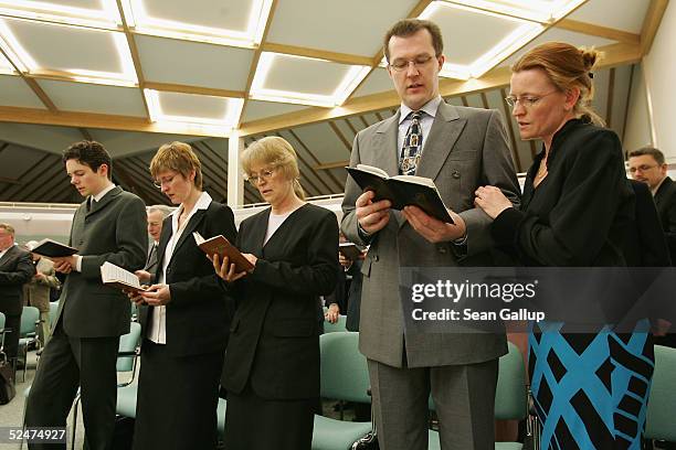 Members of the Jehova's Witnesses Church sing during a religious service March 24, 2005 in Hennigsdorf, Germany, just outside of Berlin. A Berlin...