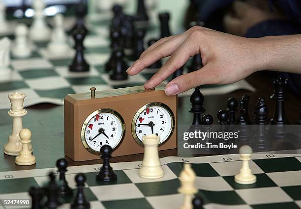 Chess player stops the timer as he participates in the Chicago Public School City Chess Championship at the Harold Washington Library March 24, 2005...